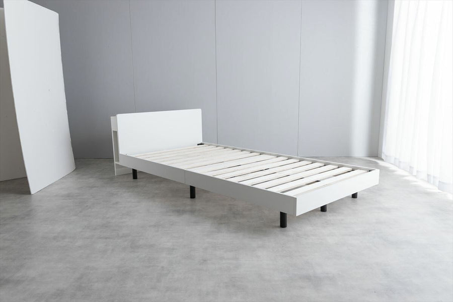 Simple single bed with outlet, headboard and bonnell mattress