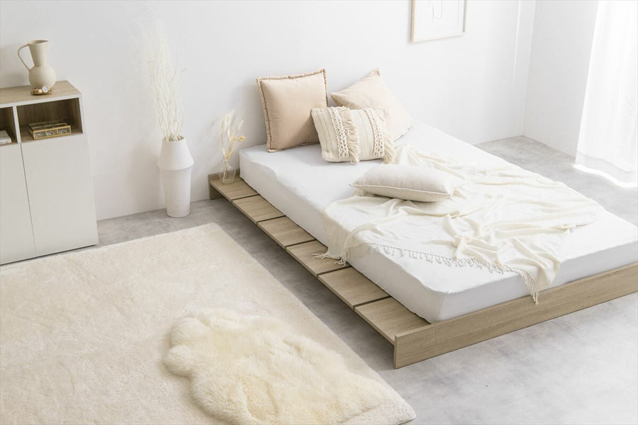 Scandinavian bonnell mattress with wide slatted semi-double low bed