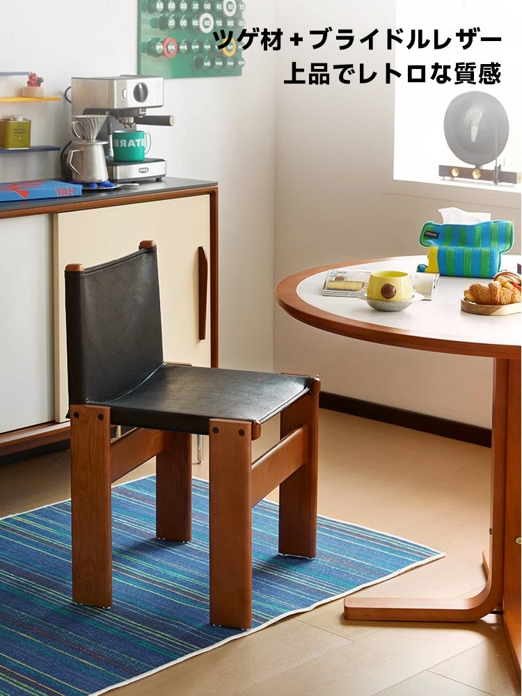 Boxwood and black leather chair