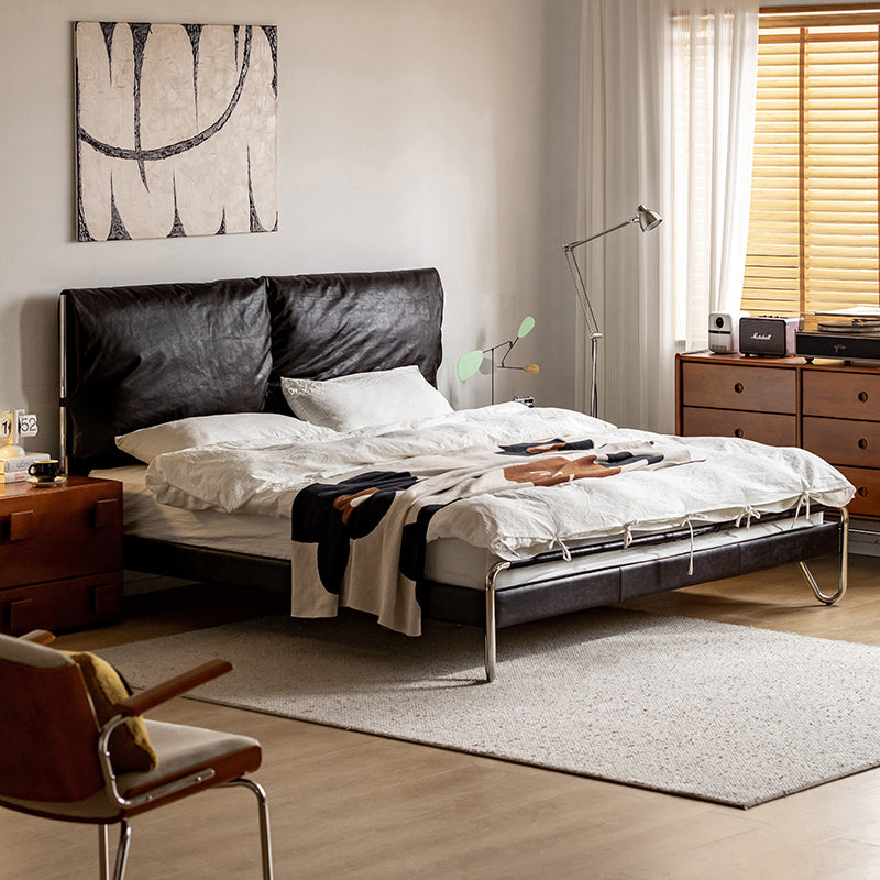 Bed with waxed leather cushion