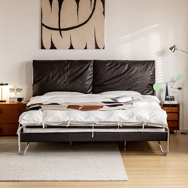 Bed with waxed leather cushion