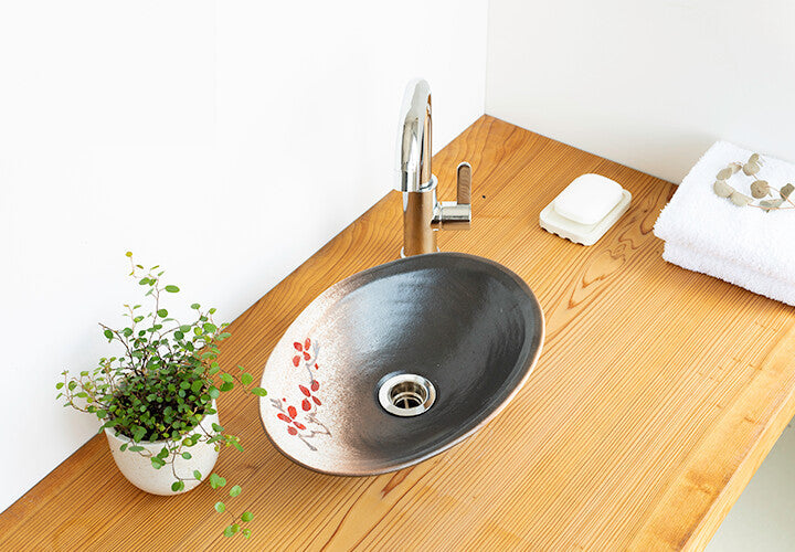 Modern Japanese-style Japanese-made ceramic oval hand washing basin with red-glazed drainage fittings