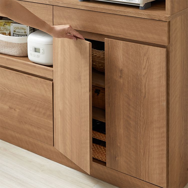 Kitchen cabinet with storage for cooking utensils