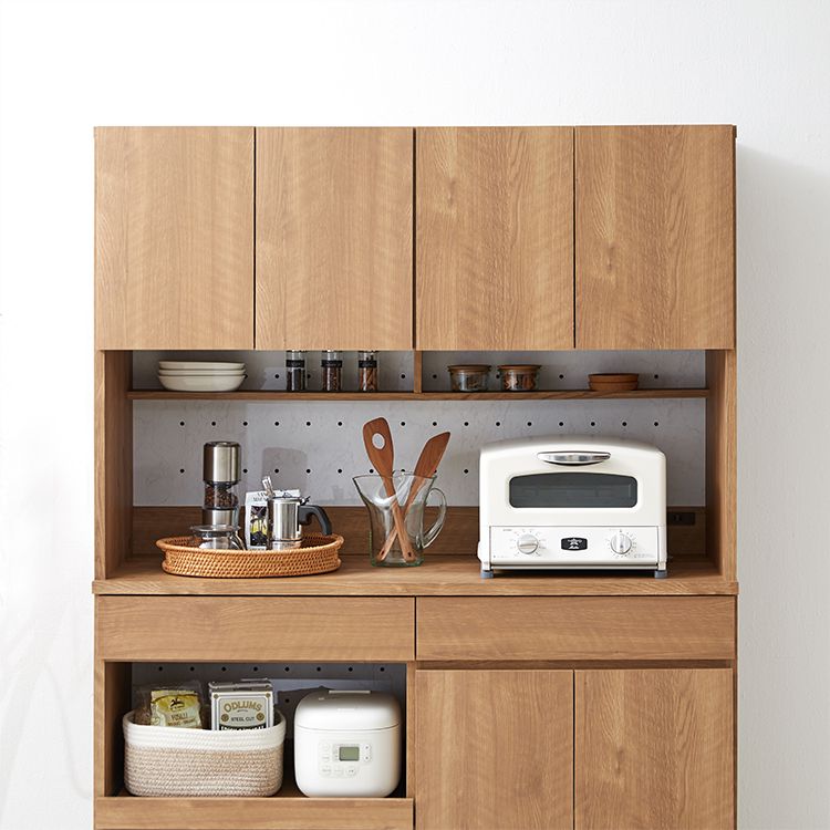 Kitchen cabinet with storage for cooking utensils