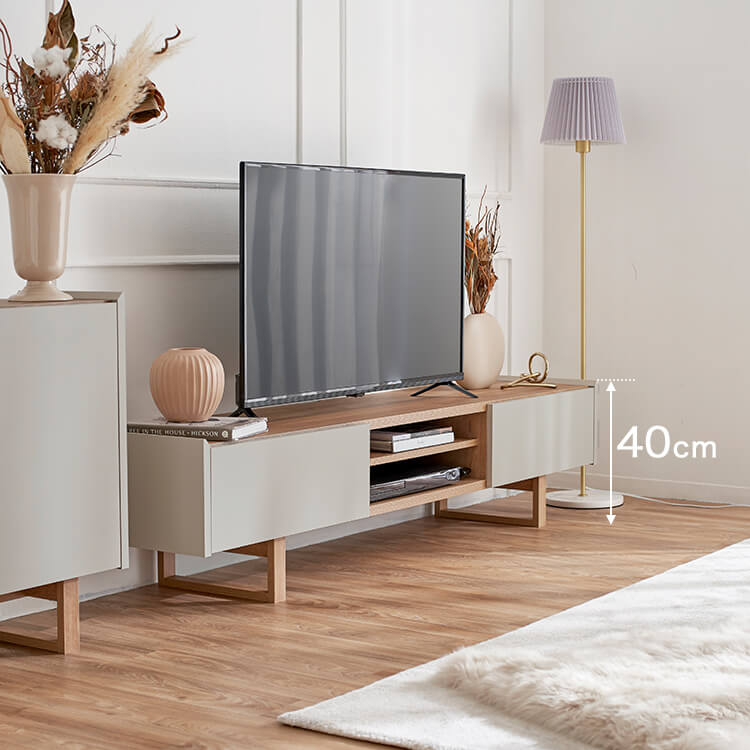 A stylish TV stand in shabby natural and beige