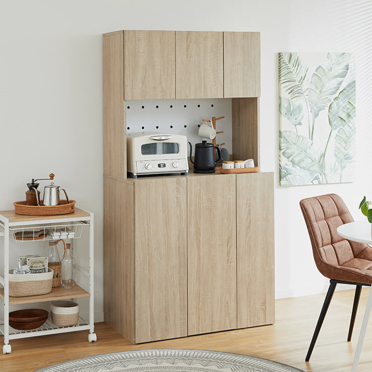 A cupboard perfect for storing things above trash cans