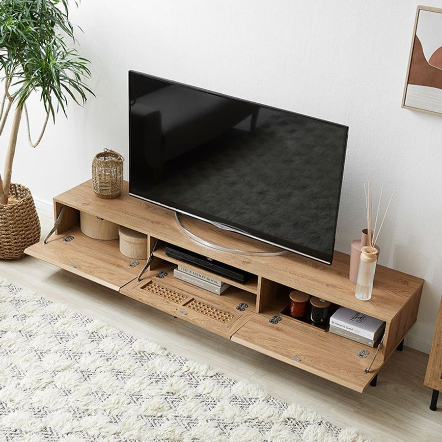 Steel-legged TV stand with rattan finish and cord hole