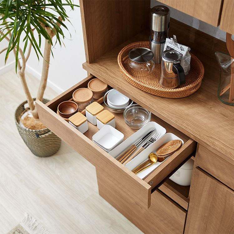Kitchen cabinet with storage for cooking utensils