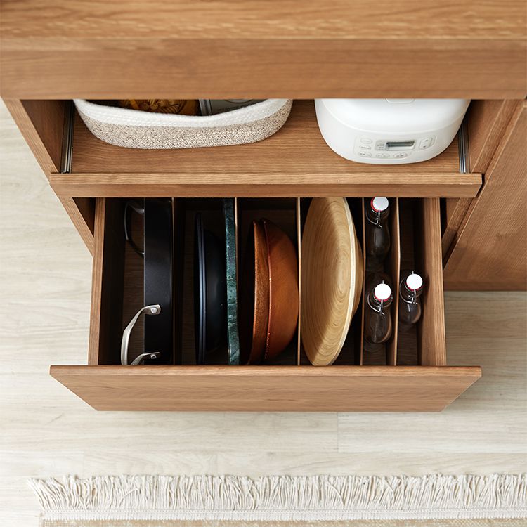 Kitchen cabinet with storage for cooking utensils