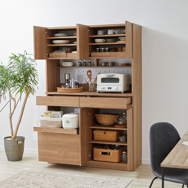 Kitchen cabinet with storage for cooking utensils