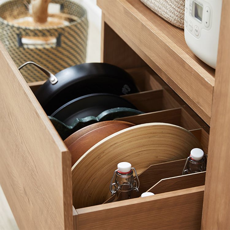Kitchen cabinet with storage for cooking utensils
