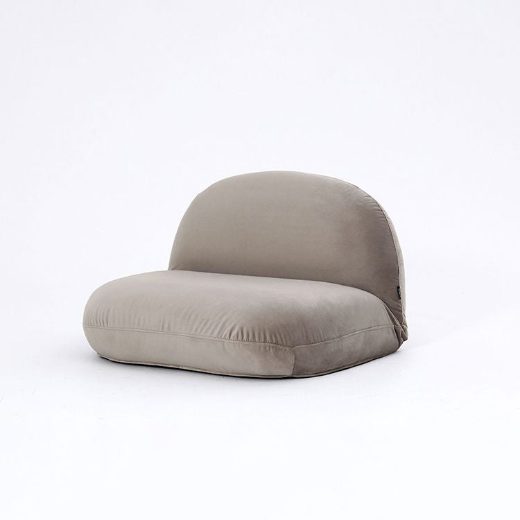 A velvet-like chair with a stylish, plump design