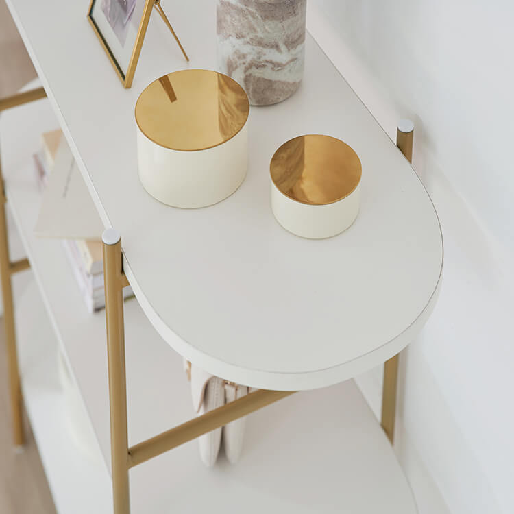 A stylish open shelf in white and gold with 3 tiers
