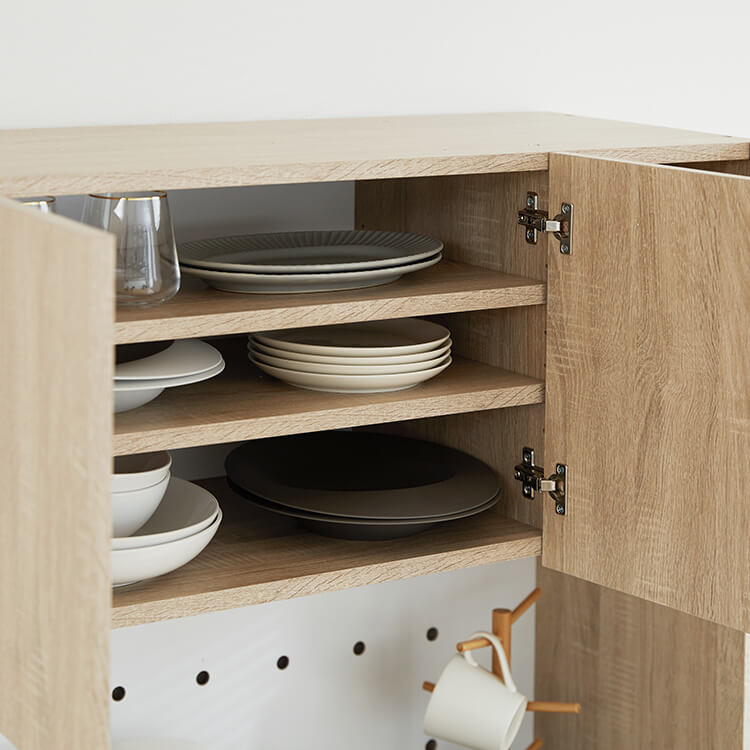 A cupboard perfect for storing things above trash cans