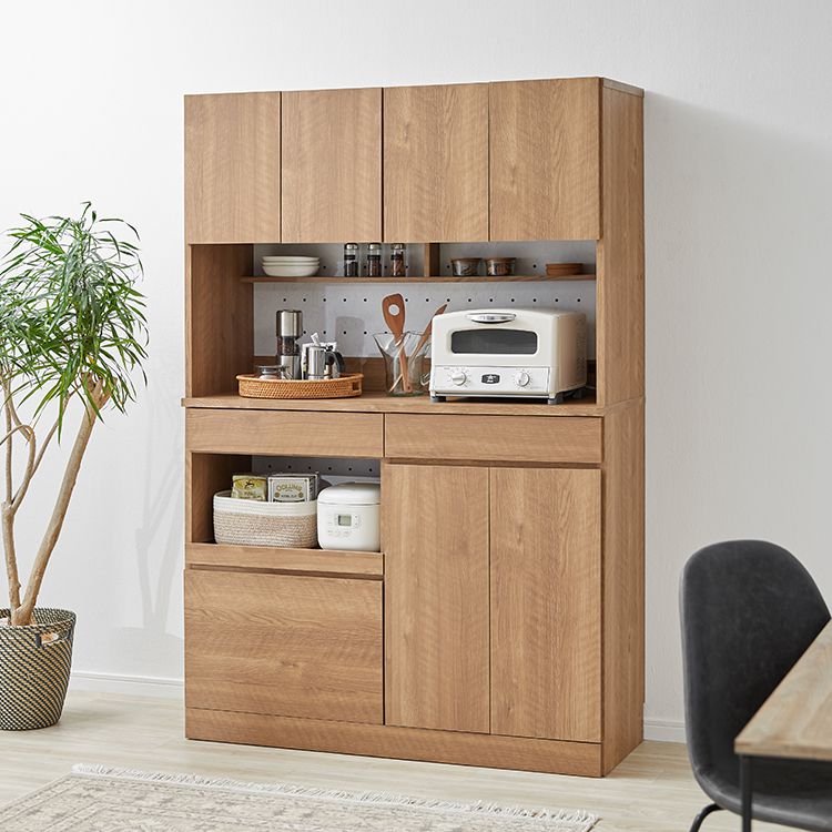 Kitchen cabinet with storage for cooking utensils