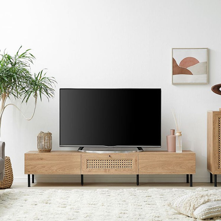 Steel-legged TV stand with rattan finish and cord hole