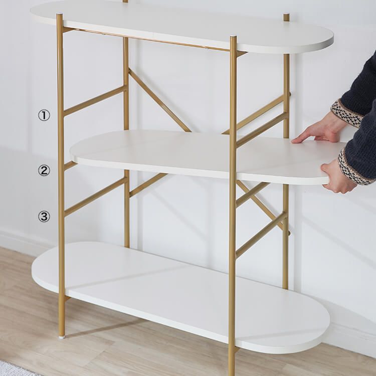A stylish open shelf in white and gold with 3 tiers