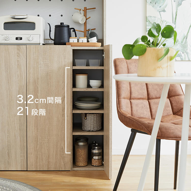 A cupboard perfect for storing things above trash cans