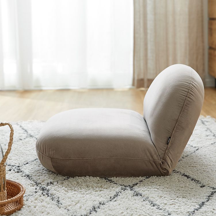 A velvet-like chair with a stylish, plump design