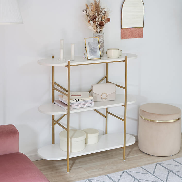 A stylish open shelf in white and gold with 3 tiers