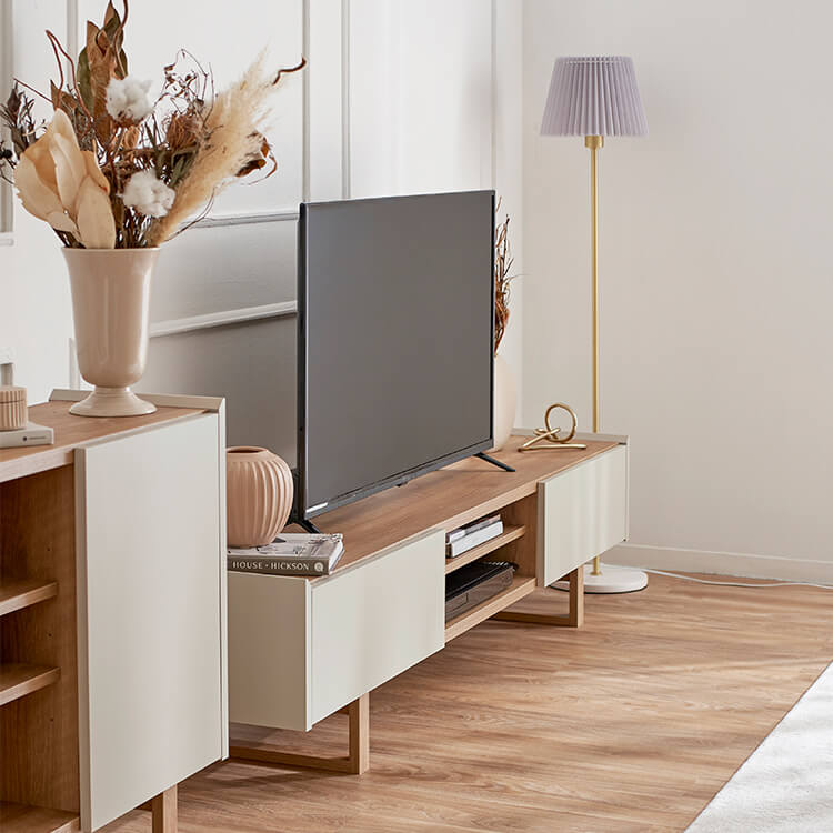 A stylish TV stand in shabby natural and beige