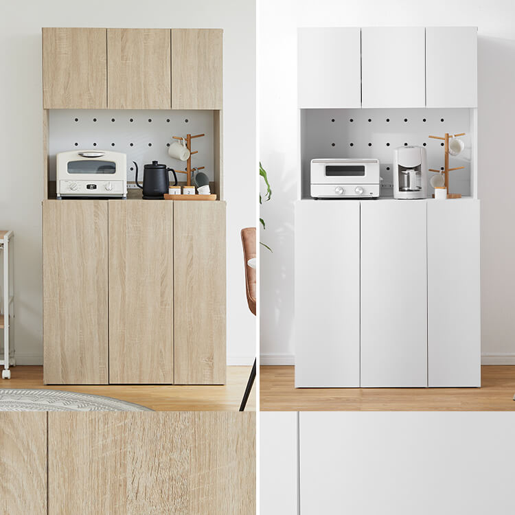 A cupboard perfect for storing things above trash cans