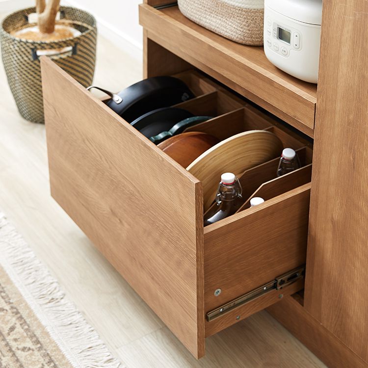 Kitchen cabinet with storage for cooking utensils