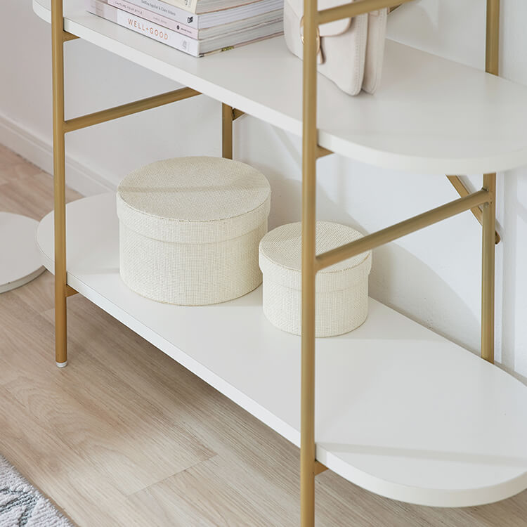 A stylish open shelf in white and gold with 3 tiers