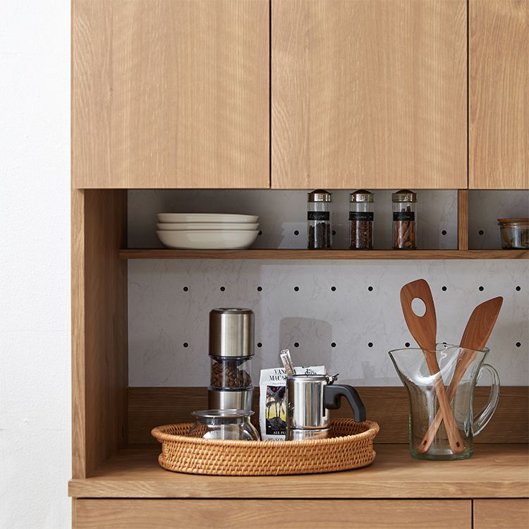 Kitchen cabinet with storage for cooking utensils
