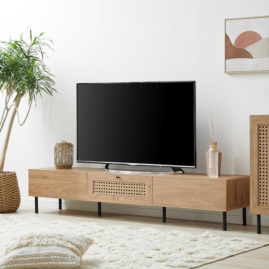 Steel-legged TV stand with rattan finish and cord hole