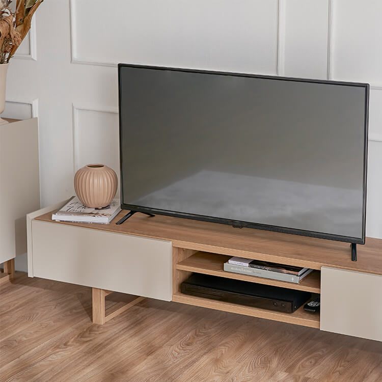 A stylish TV stand in shabby natural and beige