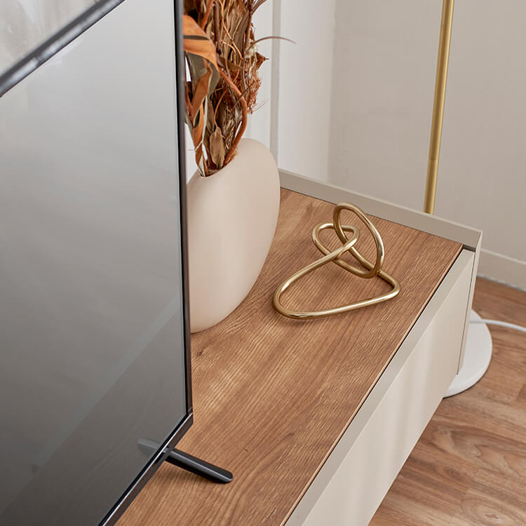 A stylish TV stand in shabby natural and beige