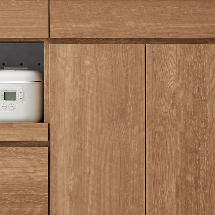 Kitchen cabinet with storage for cooking utensils