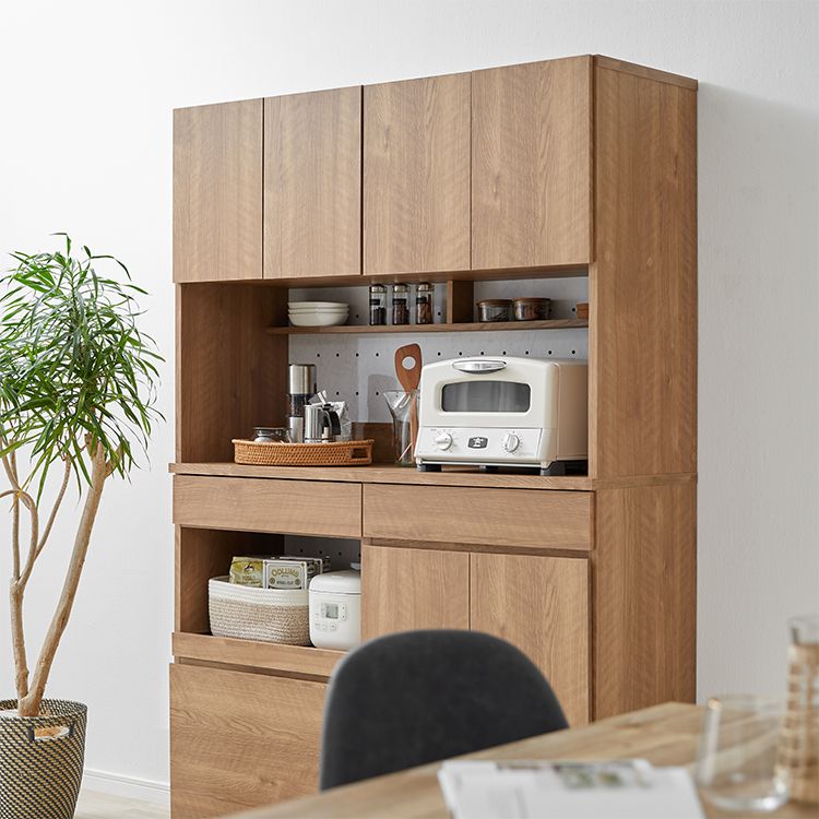 Kitchen cabinet with storage for cooking utensils