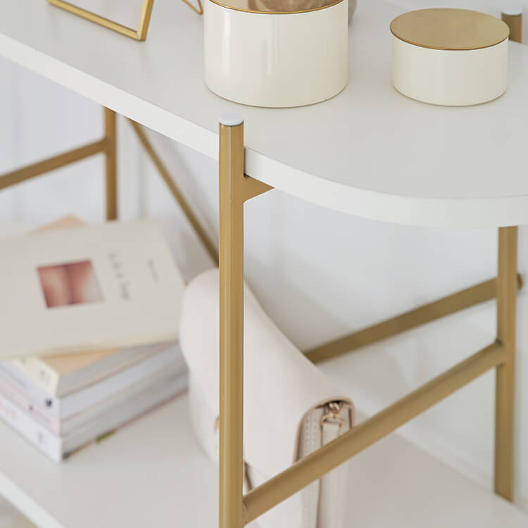 A stylish open shelf in white and gold with 3 tiers