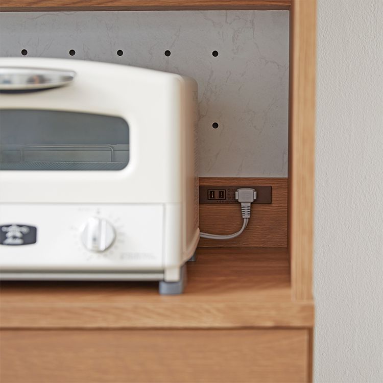 Kitchen cabinet with storage for cooking utensils