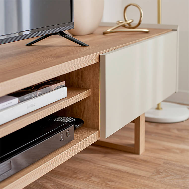 A stylish TV stand in shabby natural and beige