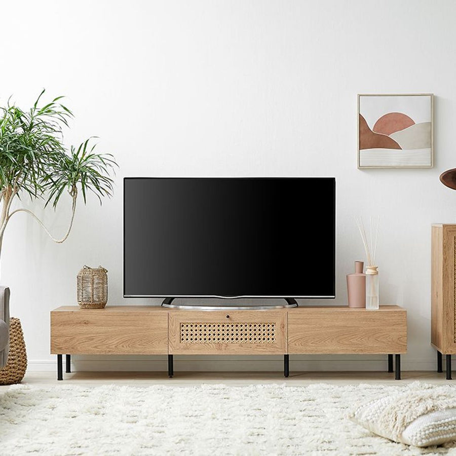 Steel-legged TV stand with rattan finish and cord hole